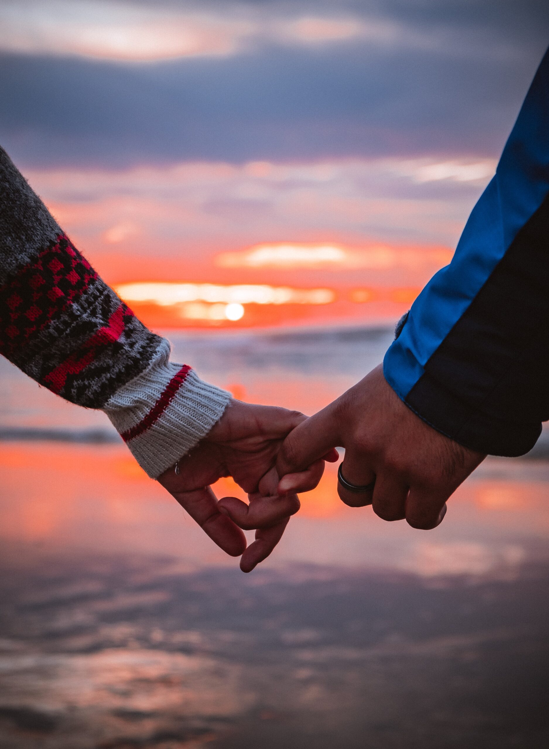 Love scene of couple holding hands